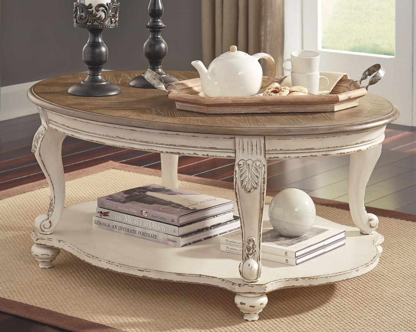 Realyn - Oval Cocktail Table - White / Brown