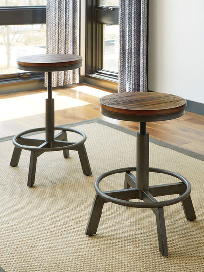 Torjin - 3 Pc. - Long Counter Table, 2 Stools - Dark Brown